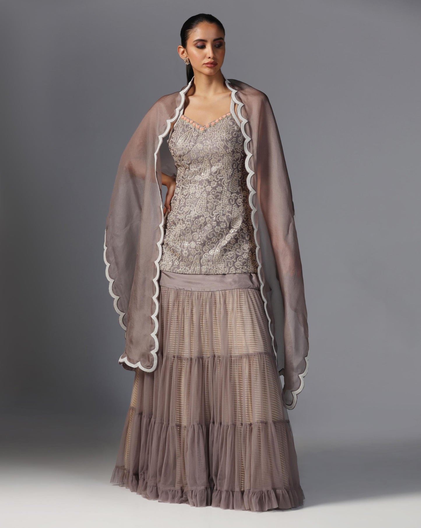 Smoky Taupe Tiered Lehenga Set  Description: