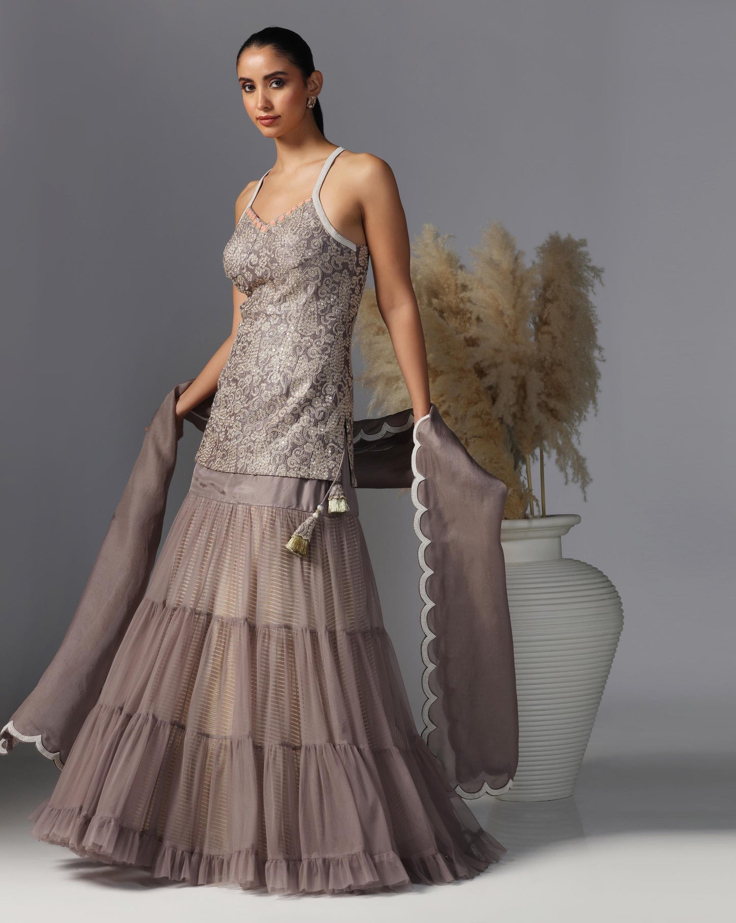 Smoky Taupe Tiered Lehenga Set  Description: