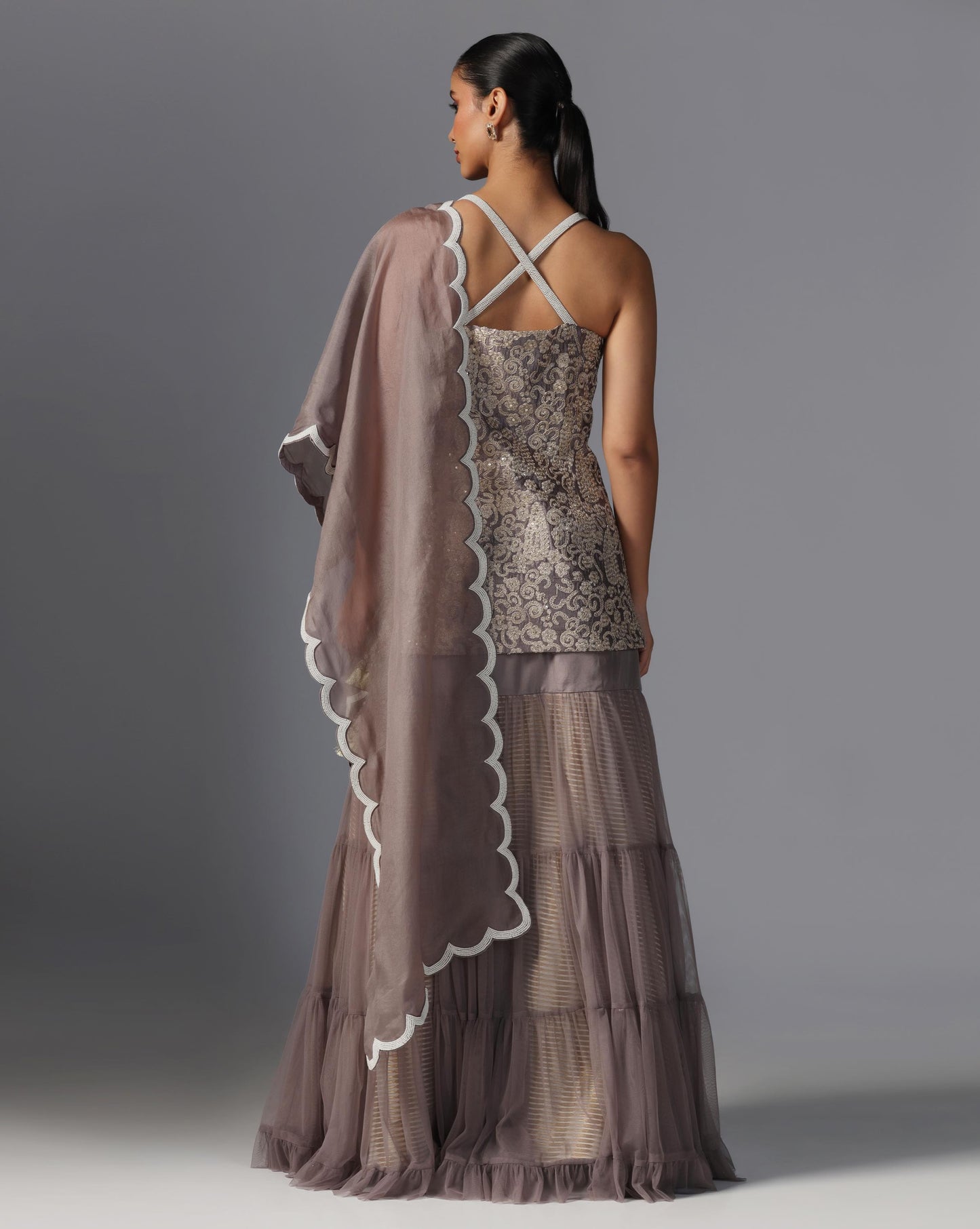 Smoky Taupe Tiered Lehenga Set  Description:
