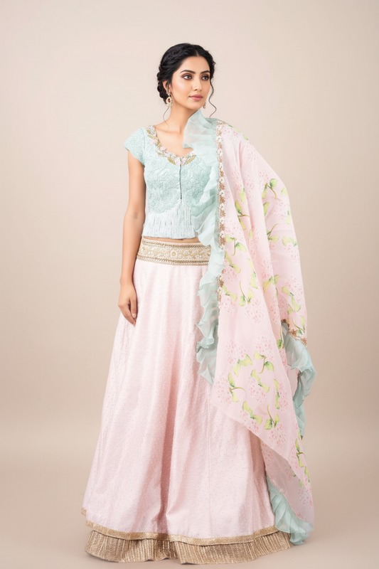 PERSIAN DORI ECO GREEN BLOUSE WITH FRINGES PAIRED WITH PEARL WORK PINK RAW SILK LEHENGA